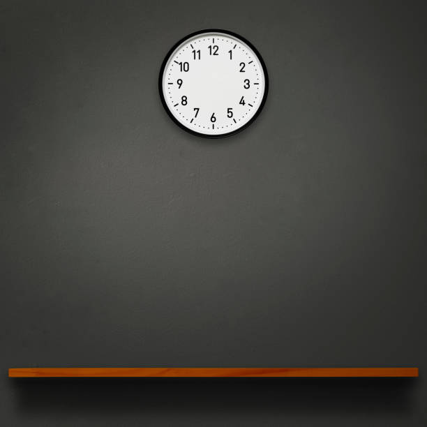 istock Blank wall clock above the wooden shelf 1568839308