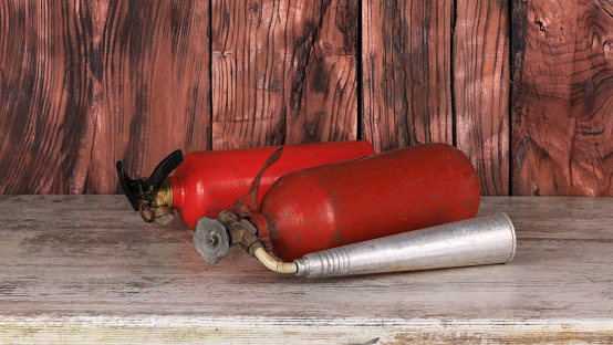 fire extinguisher on wooden table