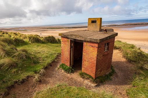 Derelict ww2 building abandoned on Driggs beach on the Cumbria coast north east England UK
