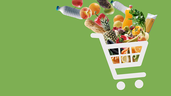 Shopping cart icon full of fresh groceries, online grocery shopping concept