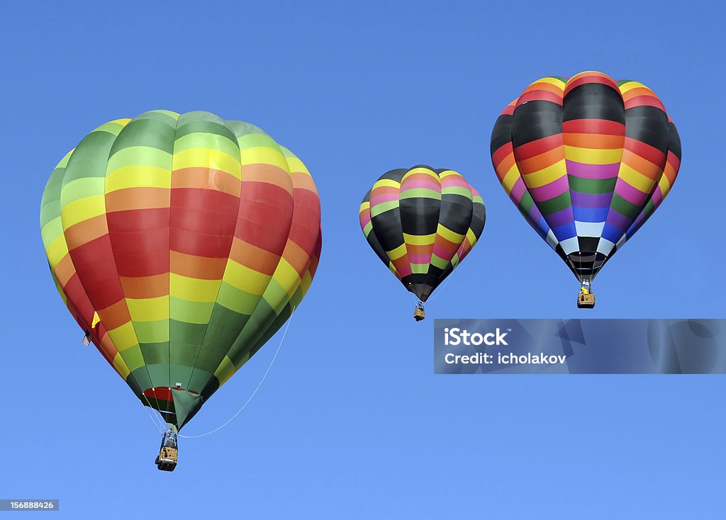 Colorful hot air balloons Three colorful hot air balloons against blue sky Hot Air Balloon Stock Photo