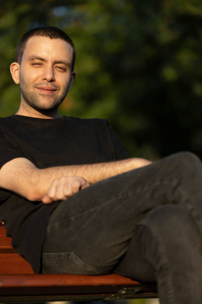 istock Portrait of handsome guy at public park. 1568888640