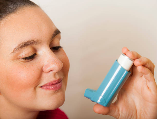 istock Cute girl with asthma inhalator 156889426
