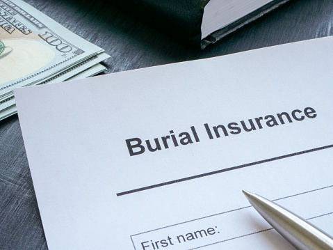 Empty burial insurance application and cash.
