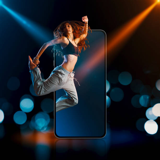 istock Dancer jumping out of a smartphone screen 1568915082