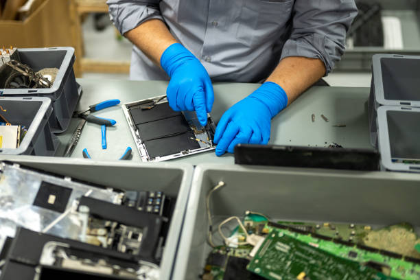 istock Man repairing laptop 1568919840