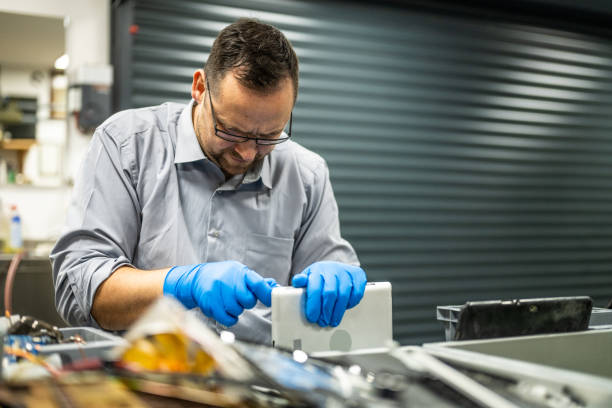istock Man repairing laptop 1568919846