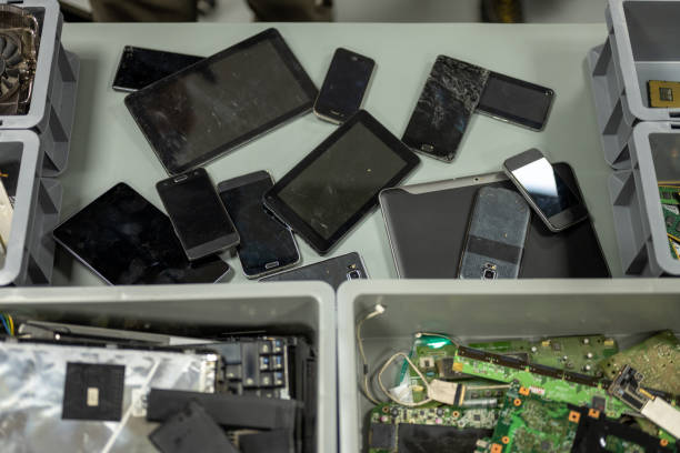 istock Old smart phones and digital tablets on desk 1568919856
