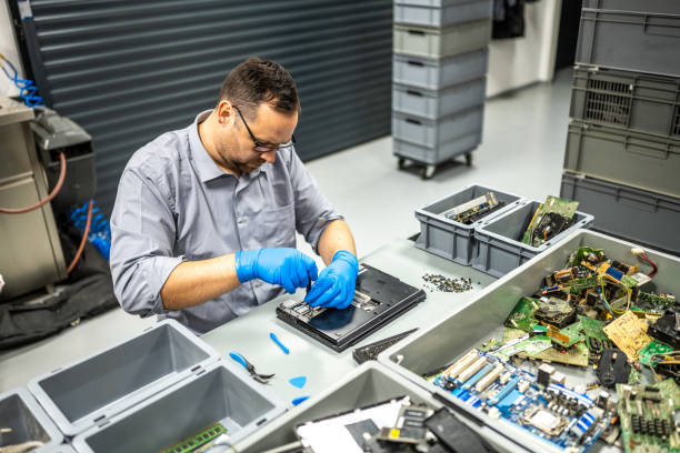 istock Man repairing laptop 1568919857
