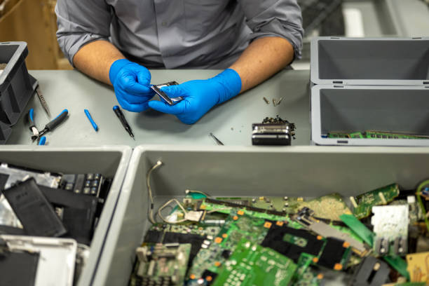 istock Man repairing mobile phone 1568919866
