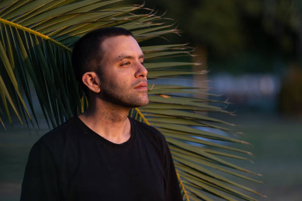 istock Portrait of handsome guy at public park. 1568928097