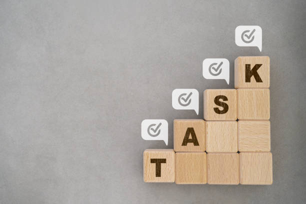 istock For Checklist, Task list, Survey and assessment, Quality Control, Goals achievement and business success. To do list.   TASK word on wooden block with check mark inside speech bubble, copy space 1568936318
