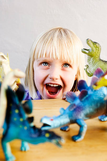 istock Baby blonde beats dinosaurs! 156893685