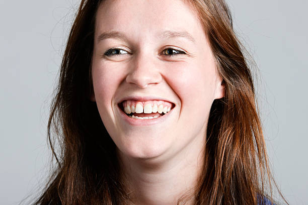 istock Pretty young redhead roars with laughter in close up 156893884