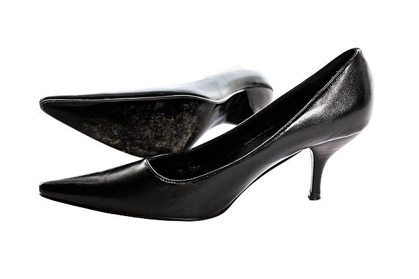 Spike on black high heel shoes isolated on white background