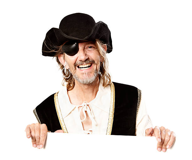 istock Laughing pirate holds blank board for your message 156894620