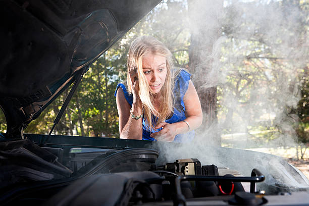 istock Desperate blonde babe on mobile phone reporting car breakdown 156894651