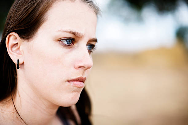 istock Seriously beautiful young woman in three-quarter profile 156896739