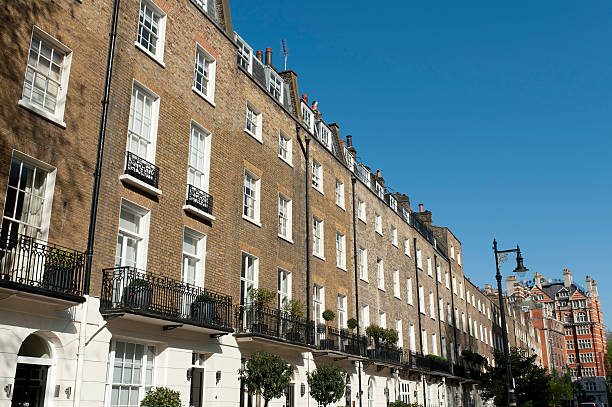 istock A townhouses against a blue sky 156898486