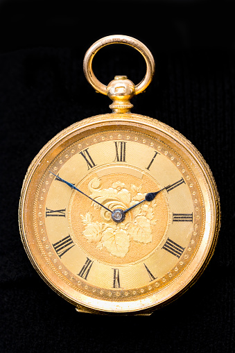 Holding an antique brass compass