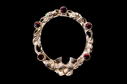 Antique kilt clasp or shawl clasp in white gold with five ruby stones adorned and woven with the Scottish thistle theme