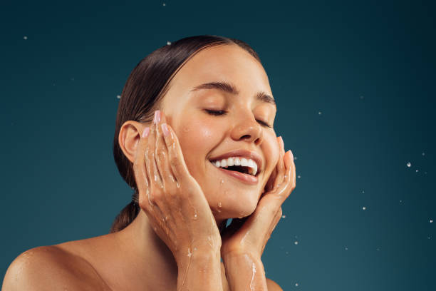 istock Girl washes her face 1569019153