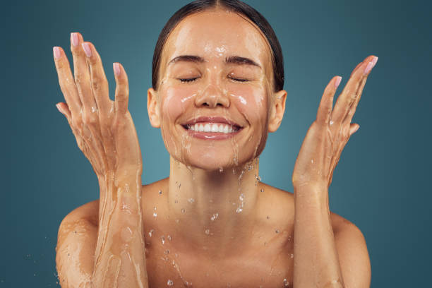 istock Girl washes her face 1569019745