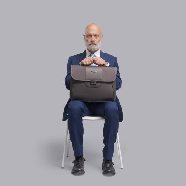 istock Corporate businessman waiting for a meeting 1569031561