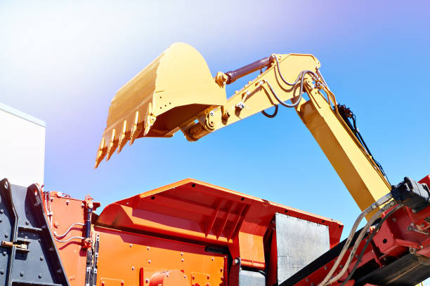 istock Mobile impact crusher and bucket excavator 1569042353