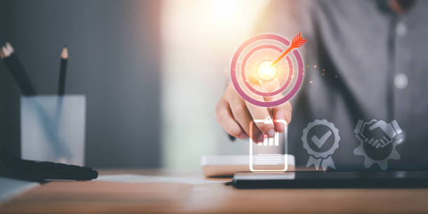 istock businessman showing business goal setting concept ,Target Growth development planning ,Organizational growth and objectives , marketing strategy planning ,Targeted growth of the organization 1569043589