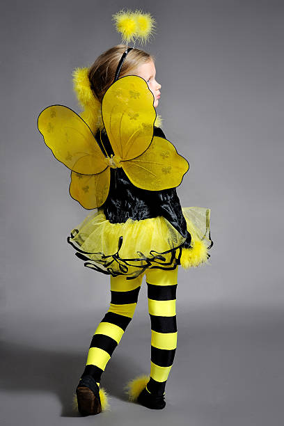 Small girl is dressed at bee costume Small girl is dressed at bee costume bee costume stock pictures, royalty-free photos & images