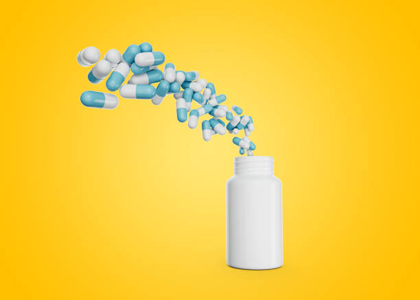 istock 3d Empty White Pill Bottle, Antibiotic capsules Flying In The Air Yellow Background 3d Illustration 1569088531