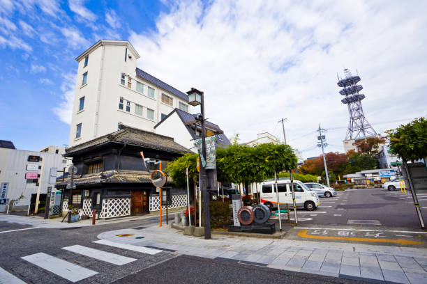 istock Nakamachi is a street lined by several nicely preserved, old buildings, including a number of warehouse-type buildings (kura) with massive, white painted walls, a characteristic of former merchant districts. 1569123727