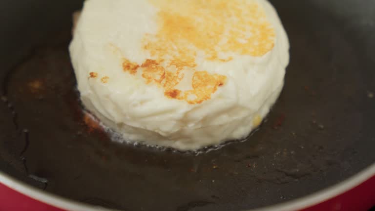 Preparation of halloumi cheese. Cooking fried food. Selective focus