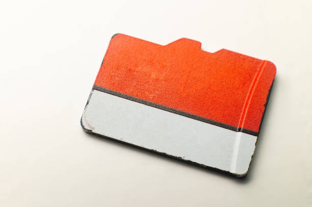 istock Micro SD memory card on a white background. close-up, top view. Color map in white and red coloring 1569178650