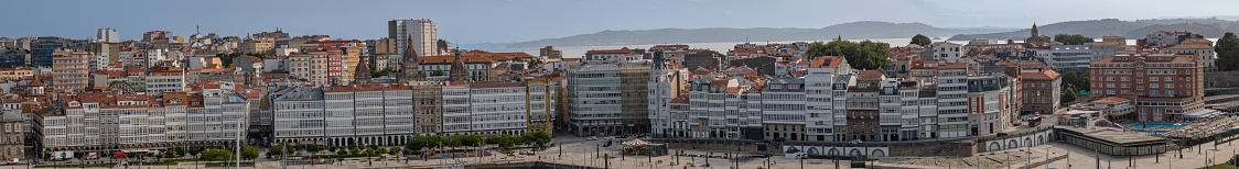 Panorama showing similar houses lined on the waterfront on A Coruña, Spain harbour