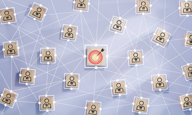 istock Red dartboard and red arrow connection linkage with human icon for customer focus target group and customer relation management concept. 1569187664