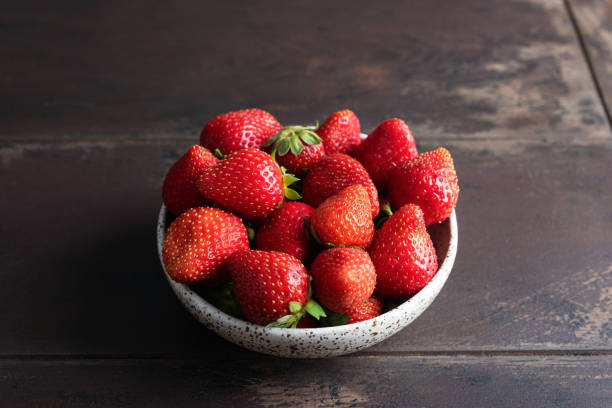 istock Fruit bowl of Strawberries 1569210456