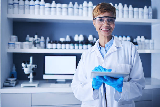 istock Science, tablet and black woman in laboratory for experiment, pharma innovation and planning. Portrait smile, female scientist and digital medicine of test development, data analysis or biotechnology 1569218702