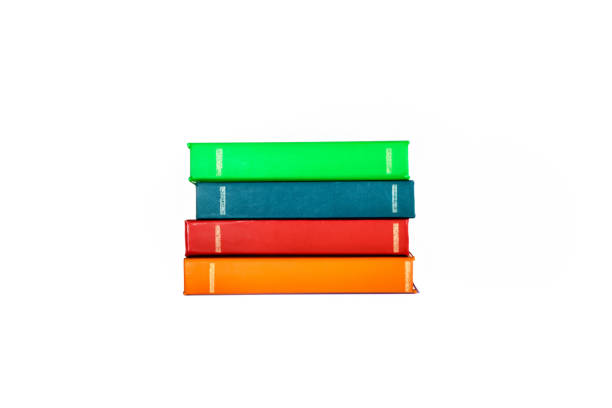 istock Side view image showing 4 thick hardcover books stacked on a white background, isolated. 1569229288