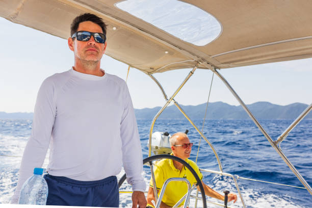 istock Crew members enjoying sailing on sailboat 1569243200