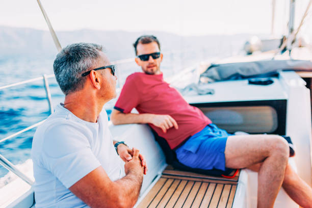istock Crew members enjoying sailing on sailboat 1569245393