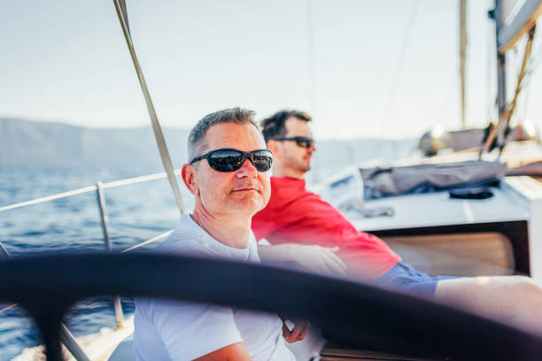 istock Crew members enjoying sailing on sailboat 1569247018