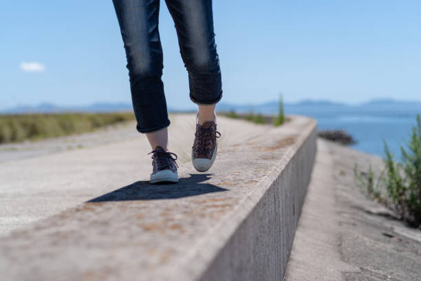 istock person walking on embankment 1569274279