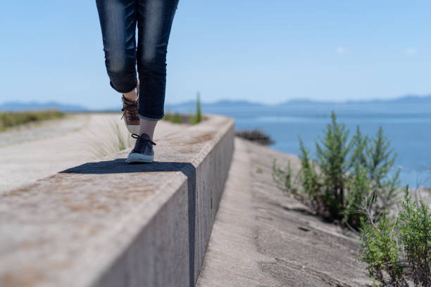 istock person walking on embankment 1569274303