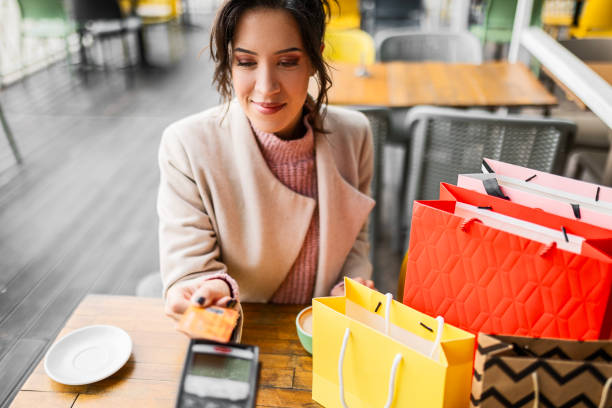 istock Card in Hand, Coffee in Sip 1569275981