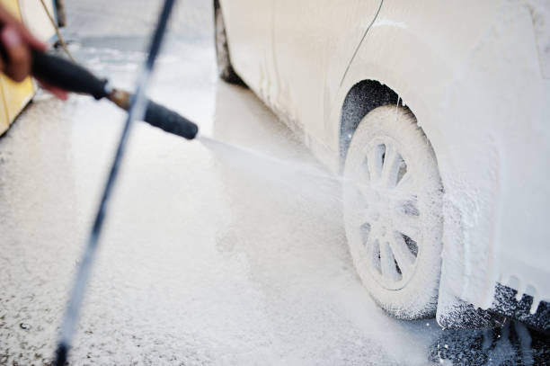 istock Washing white transportation on car wash. 1569278783