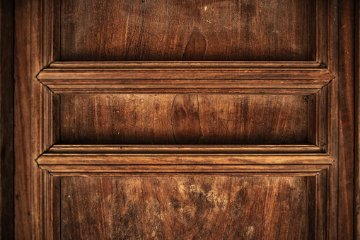 Close-up of a sunlit old-looking wooden chest