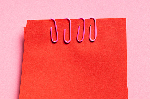 Red Stick notes on pink background. This file is cleaned and retouched.