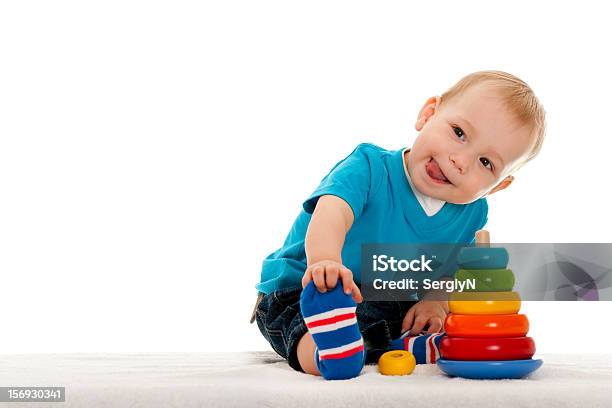 A Young Boy Playing With The Toys Stock Photo - Download Image Now - Baby - Human Age, Playful, Toy